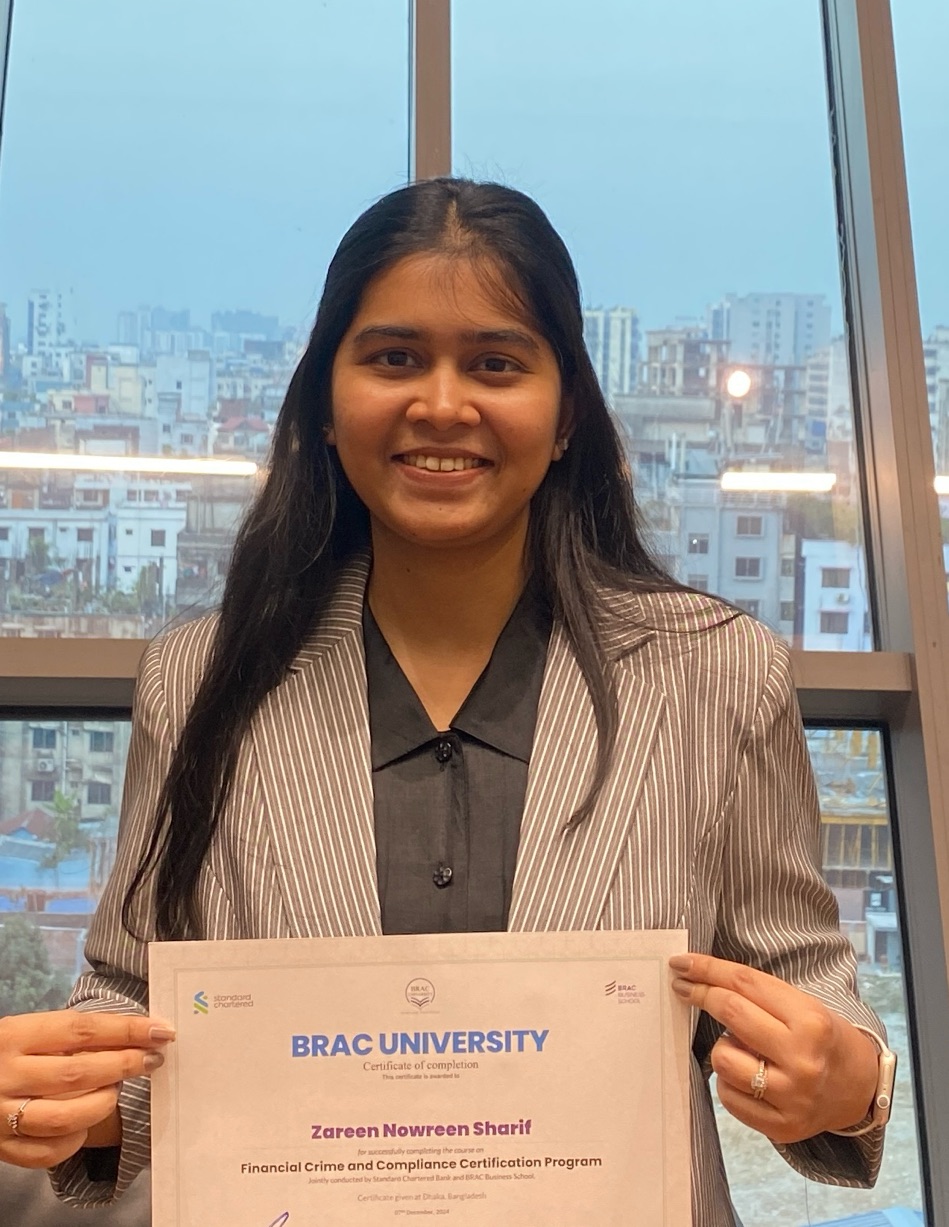 Zareen Nowreen Sharif holding her Financial Crime and Compliance certificate, Dhaka